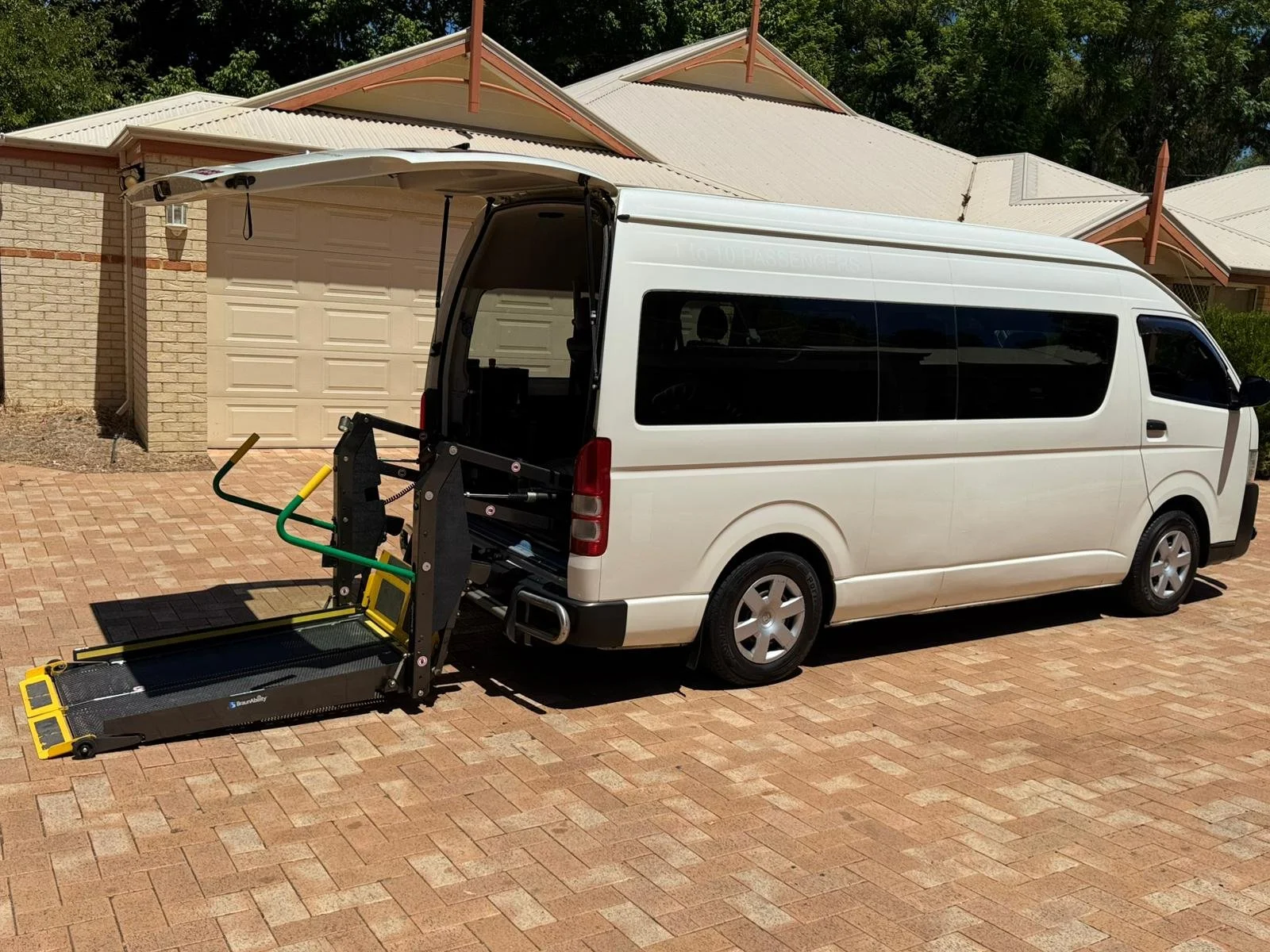 Wheelchair user boarding a Maxi Taxi Perth with a ramp